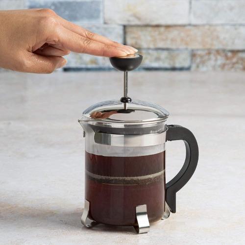 Classic Coffee Press being pressed on counter