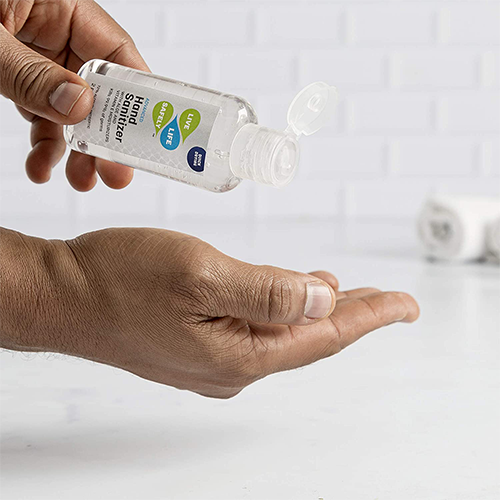Live Life Safely 2 oz  being poured onto hand