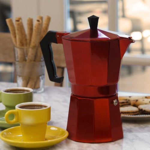Red Espresso Maker on table with food and drinks