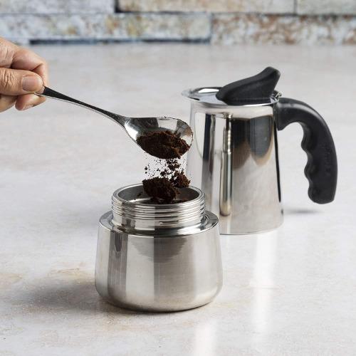 Stainless Steel Espresso Maker adding coffee on counter
