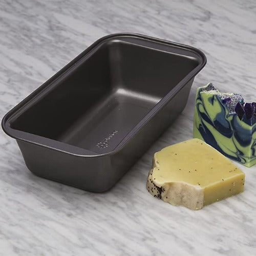 BakeIns Large Non-Stick Loaf Pan on countertop next to soap